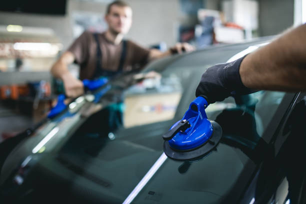 Replacement of car glass in a car service.