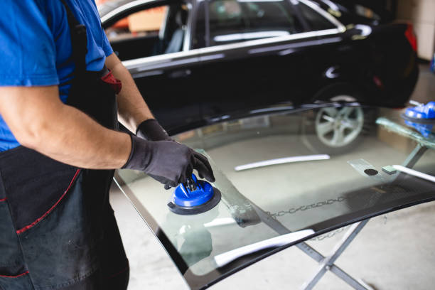 Replacement of car glass in a car service.